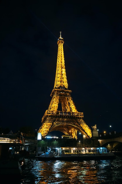 PARIS FRANCE October 21 2017 Eiffel towel view from river Siene Eiffel tower at night shine