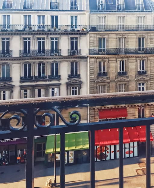 Parisian architecture and historical buildings restaurants and\
boutique stores on streets of paris france