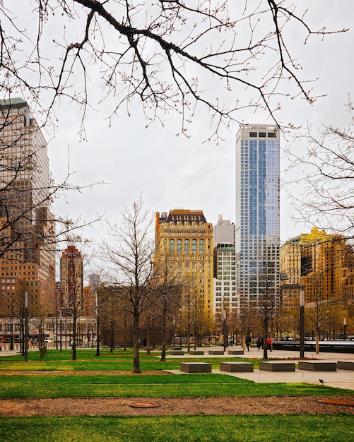 Park and Skyline with Skyscrapers in Financial Center at Lower Manhattan, New York City, America. USA. American architecture building. Panorama of Metropolis NYC. Metropolitan Cityscape