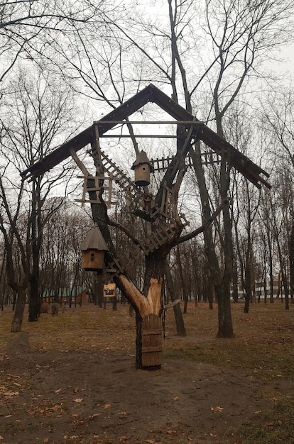 In the park there is a large wooden installation under the roof with bee hives and abstract meaning