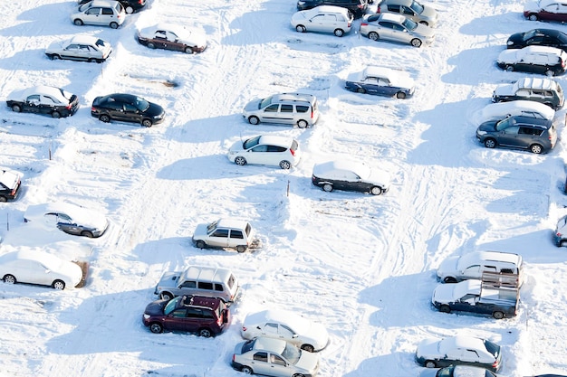 Parked cars covered with snow