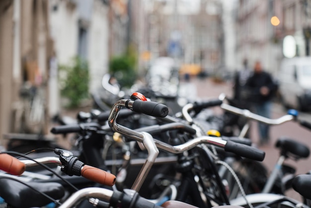 Parked city bikes Crowded European street