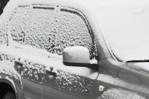 a parking car with snow