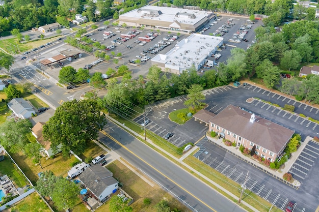 the parking lot is almost completely filled with colorful cars near the shopping center