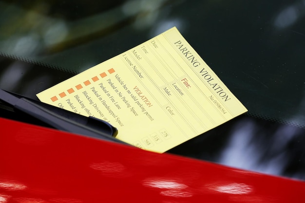 Photo parking violation ticket on car windscreen