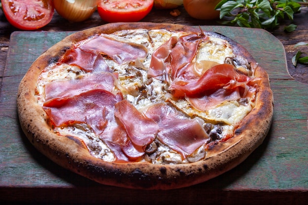 Parma ham pizza baked in the wood oven