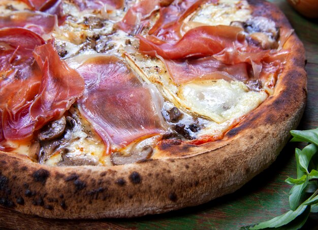 Parma ham pizza baked in the wood oven