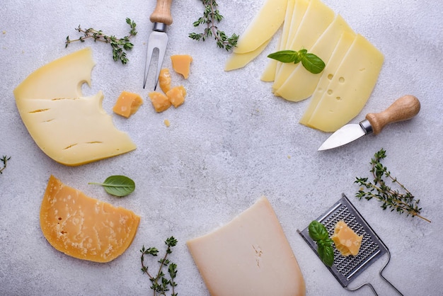 Premium Photo | Parmesan cheddar gouda and maasdam cheese