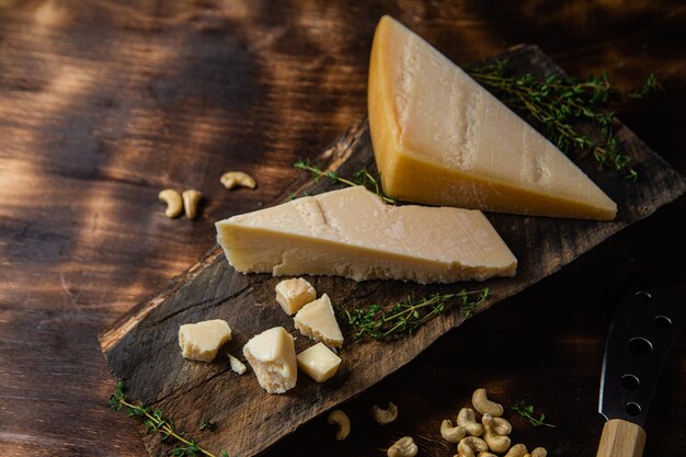 Parmesan cheese on a dark background close-up