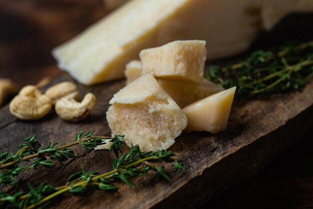 Parmesan cheese on a dark background close-up