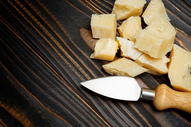 Parmesan cheese on wooden background