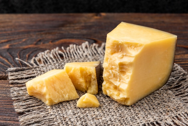 Parmesan cheese on a wooden table