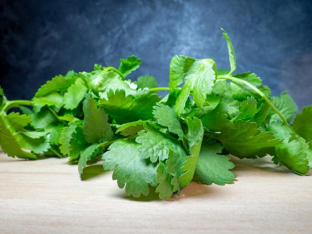 Parsley on the table Useful product Greens on a cutting board Vegetarian lunch ingredient Lots of parsley stalks