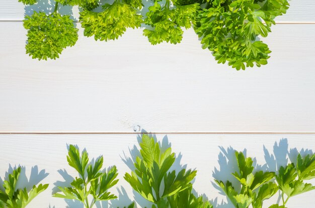 Parsley on a wooden light background, Natural lighting, rustic style. 