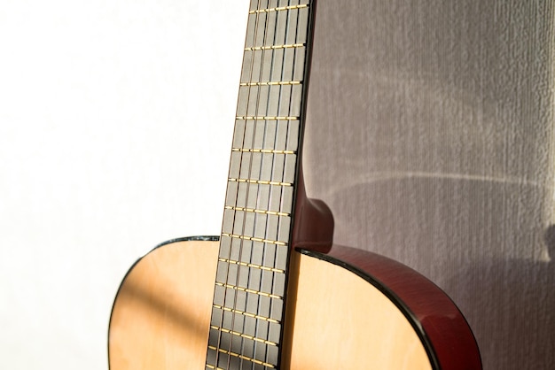 A part of brown wooden classic guitar Six strings