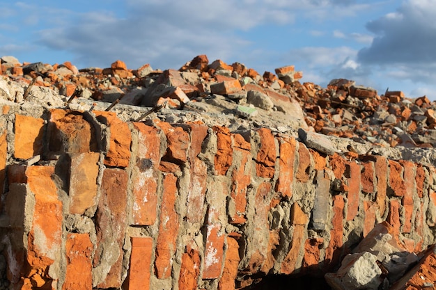 Part of the destroyed wall against a cloudy sky