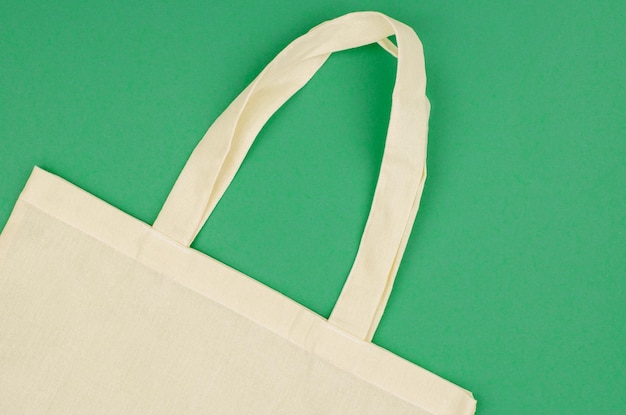 Part of an ecofriendly linen bag on a green background Eco friendly shopping bag copy space