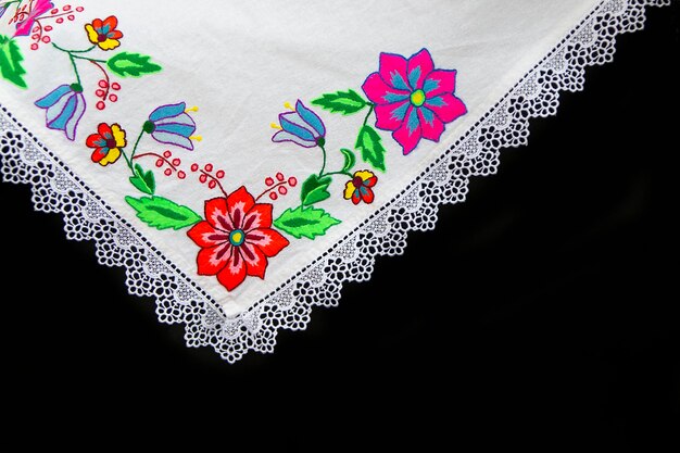 Part of the embroidered towel on a black background