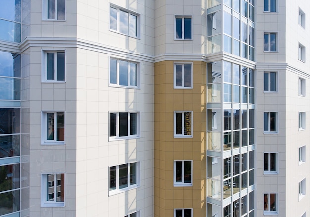 Part of the facade of a house with Windows in the city