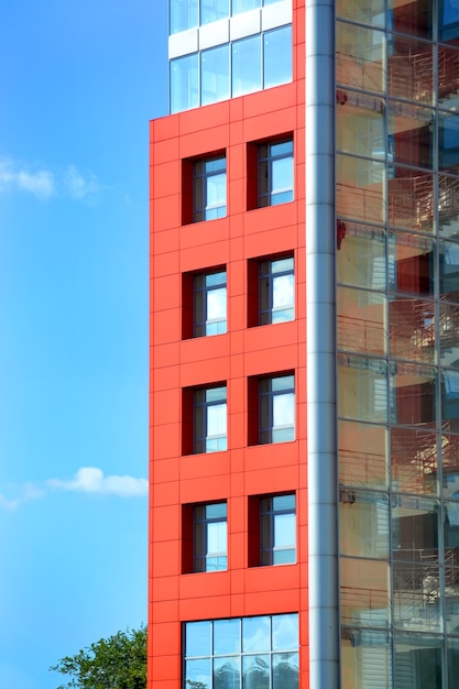 Part of the facade modern building with red and blue