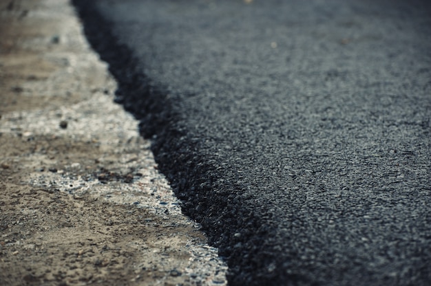 Part of fresh asphalt close-up. Construction and repair of roads.