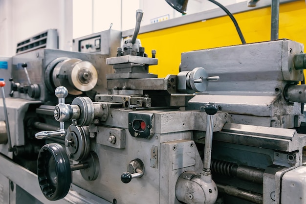 Part of lathe in workshop is closeup Old lathe for metal processing stands in factory premises