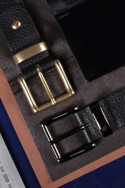 Part of leather belts with metal buckles