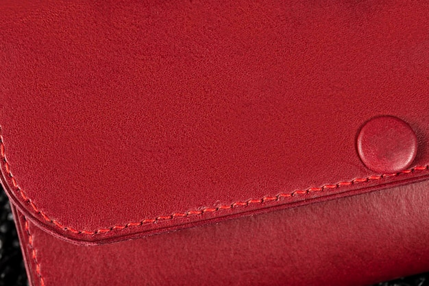 Part of a leather red wallet closeup