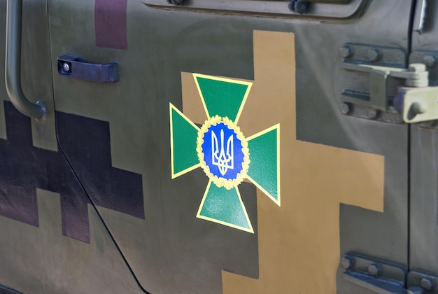 Part of a military armored car with the symbols of the Ukrainian army Military equipment