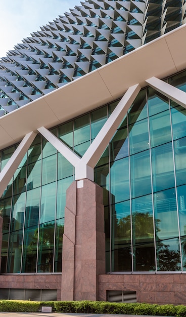 Part of modern futuristic building with strange roof 