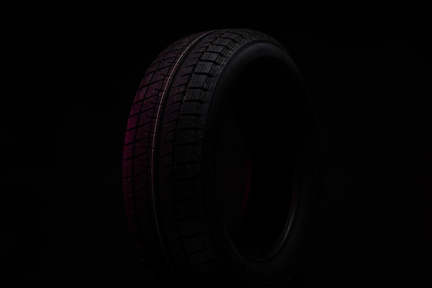 Part of a new winter tire on a black background