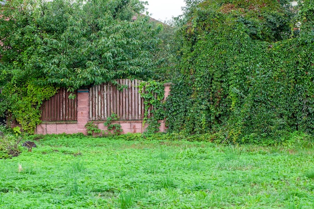 Part of the old fence made of stones and wood