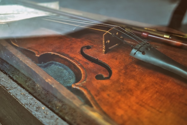 Part of the old violin behind the glass