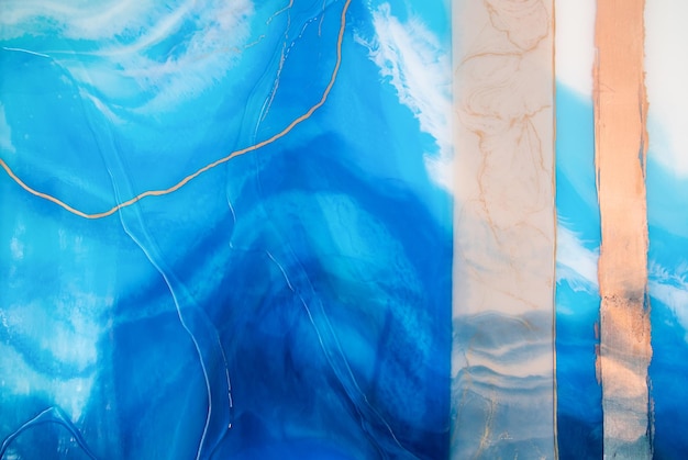 元の樹脂アート エポキシ樹脂塗装の一部 大理石のテクスチャ モダンなバナーの流体アート 空気のようなグラフィック デザイン 抽象的な空気のようなゴールド ブロンズ 青と白の渦巻き