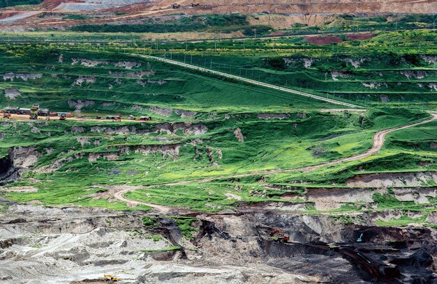 Part of a pit with big mining truck working