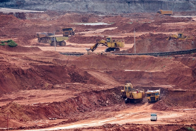 Photo part of a pit with big mining truck working