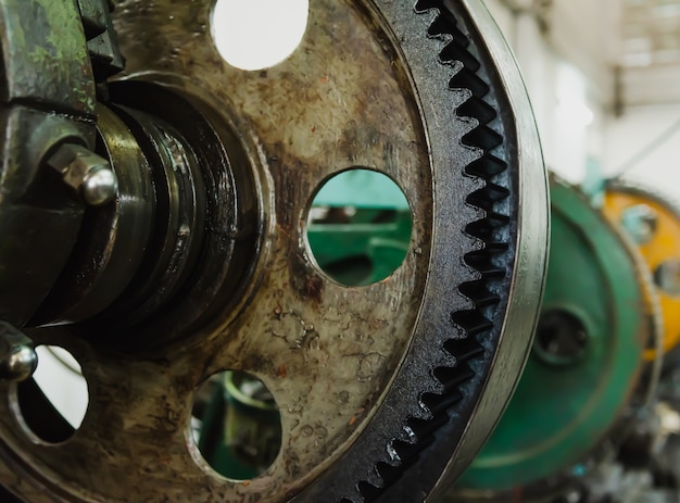 The part of the rotating lathe old machine in the factory. Metalwork lathes for the manufacture of metal parts of an industrial facility.