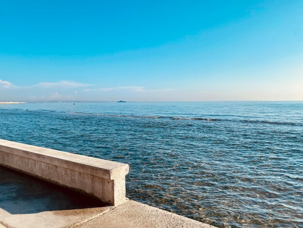 Part of the seaside concrete street in larnaca cyprus azure sea under blue sky