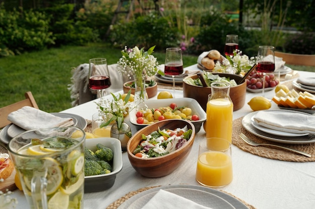 Part of served table with homemamde salad and steamed vegetables