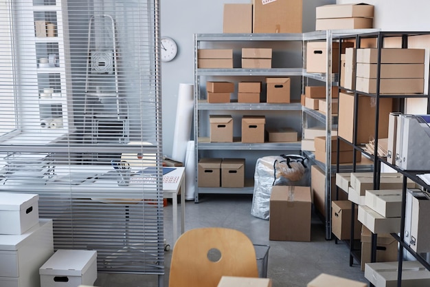 Part of spacious warehouse with packed boxes standing on shelves