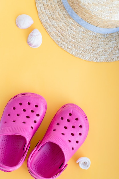 part of straw hat,  seashells, starfish on yellow