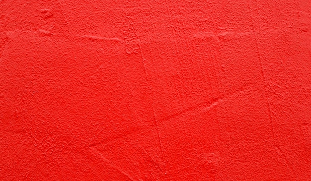 Part of wall with rough red paint on surface as texture or background