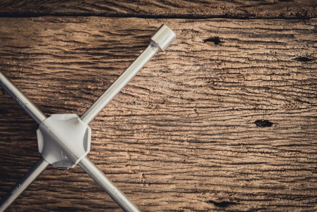 part of Wheel wrench on wooden background