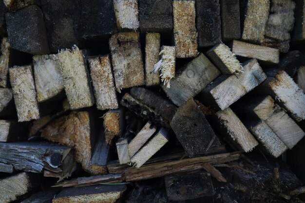 Part of a wood pile with cut needle wood wood industry brown\
background