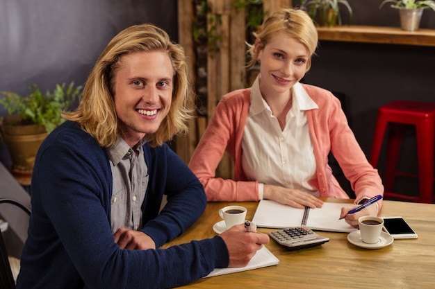 Photo partners interacting with documents and calculator