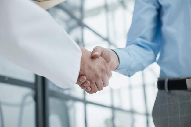 Partners or lawyers shaking hands at a meeting teamwork partnership success concept