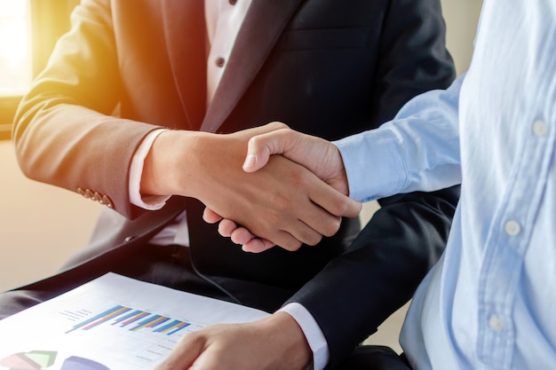 Partnership. two business man investor handshake deal with partner after finishing up business meeting in meeting room office, partner, financial, teamwork, job interview, contract agreement concept