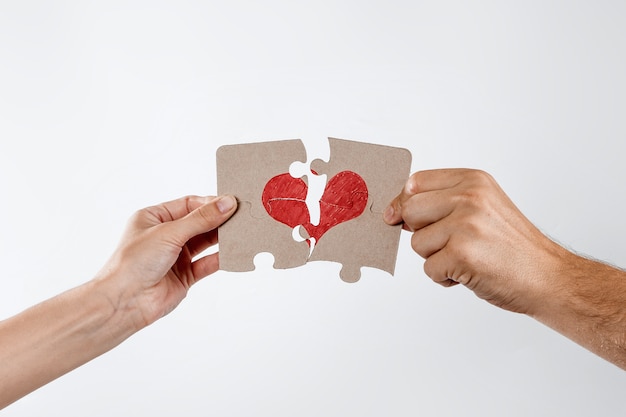 parts of the puzzle form the heart, broken