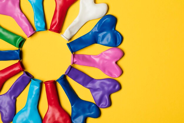 Party balloons on a bright yellow background