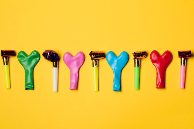 Party balloons on a bright yellow background